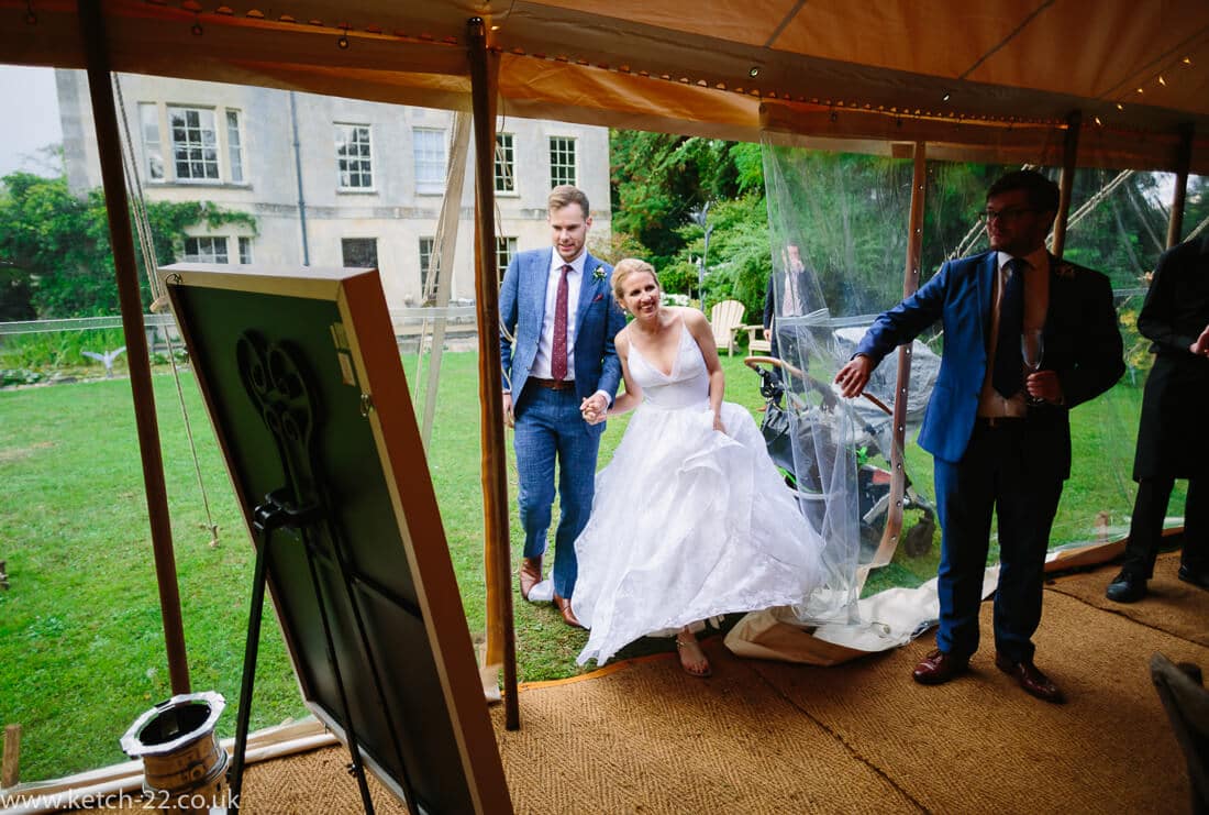 Bride and groom enter marquee