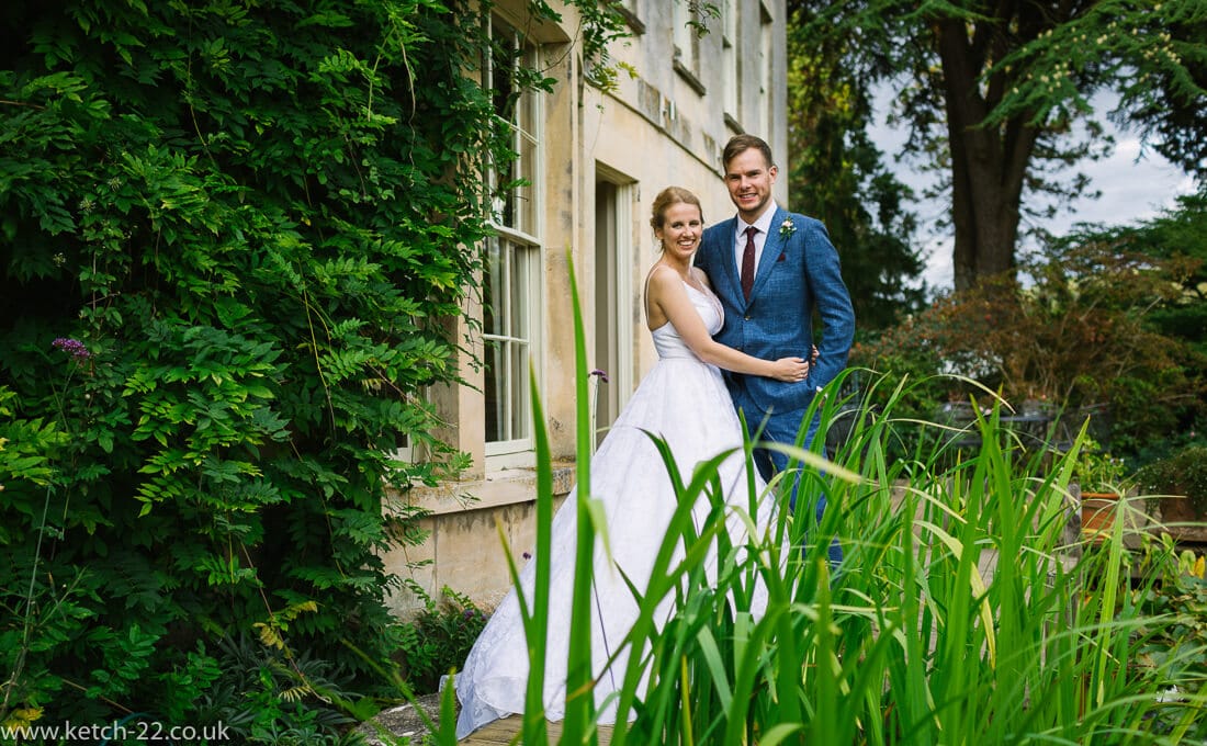 Wedding portrait of bride and groom in garden