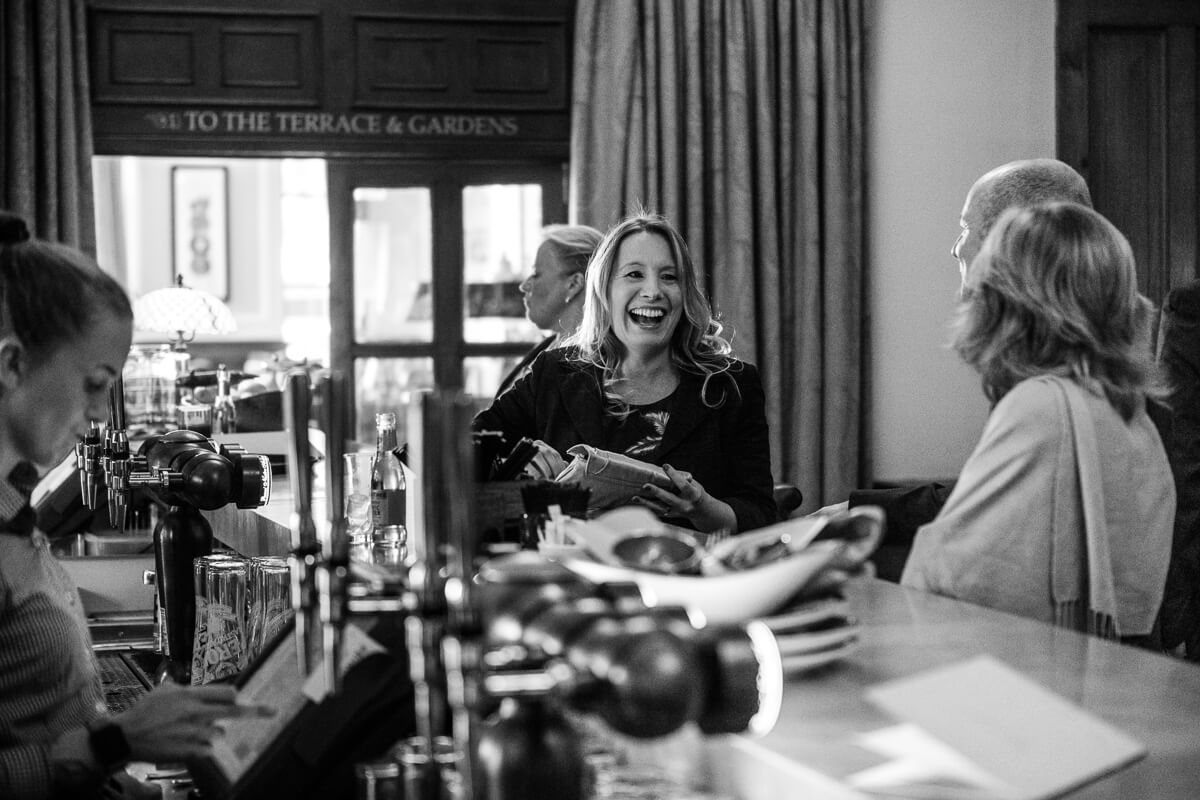 Guests relaxing in bar at De Vere Latimer Estate Wedding