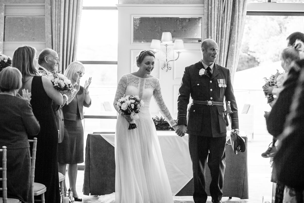 Bride and groom leaving the De Vere Estate Wedding ceremony