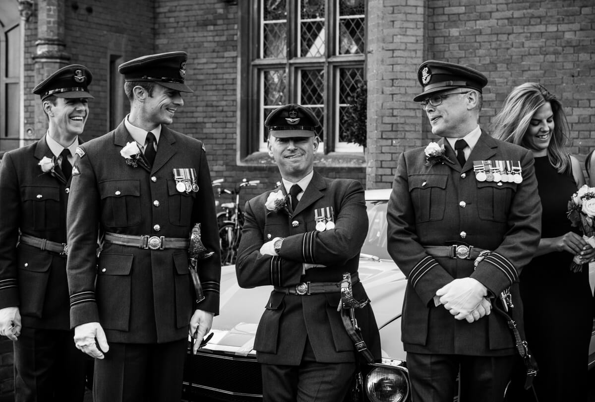 RAF groomsmen sharing a funny moment