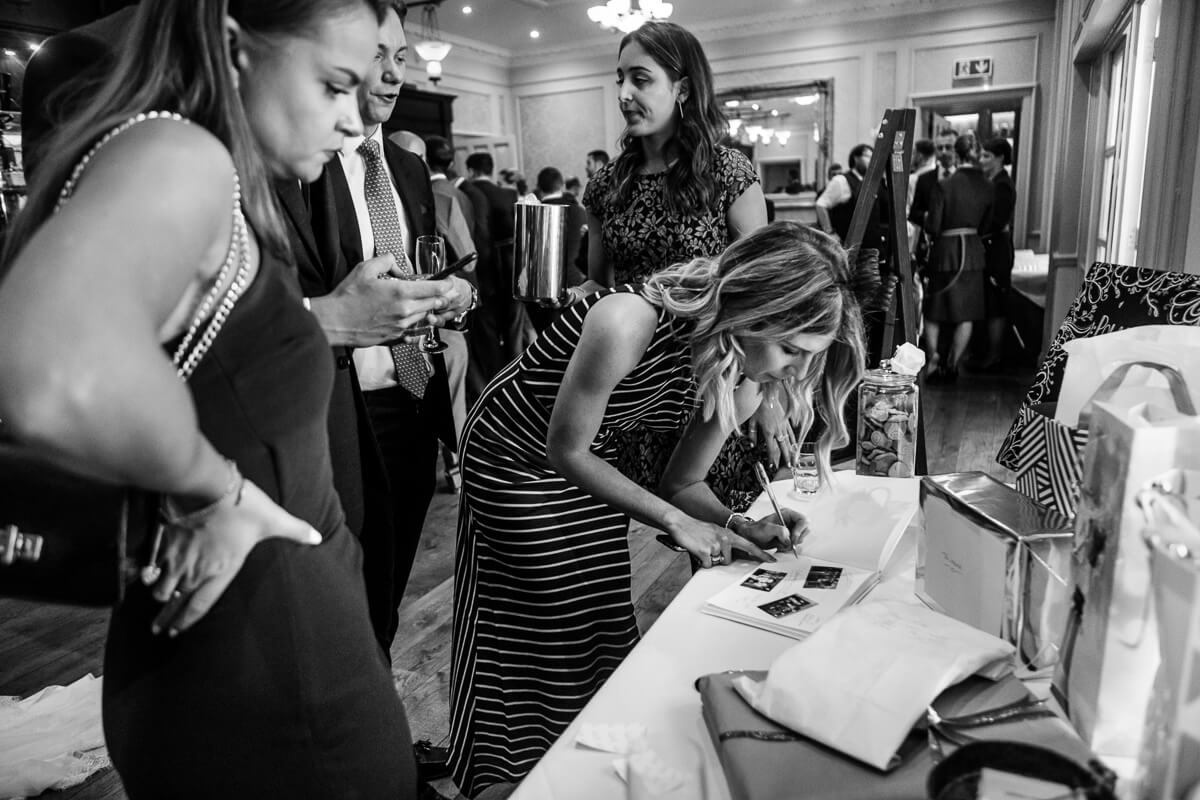 Guests signing wedding book