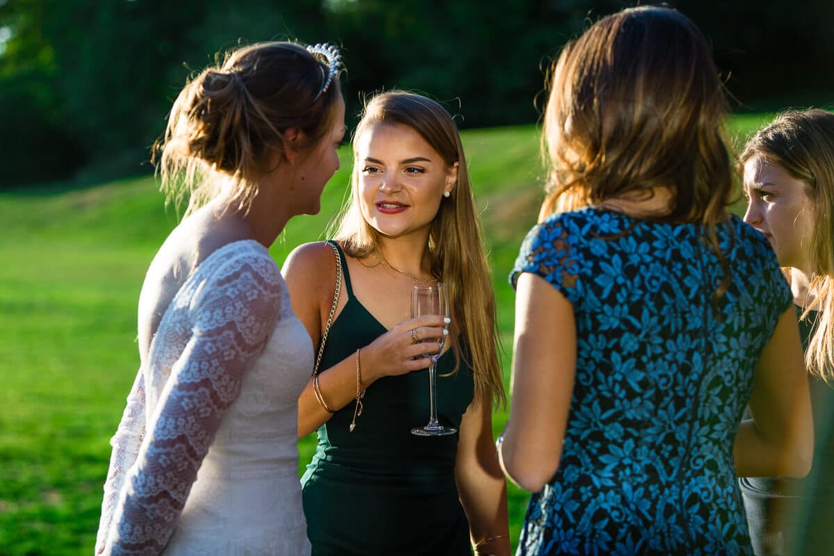 Bride chatting to her friends at reception