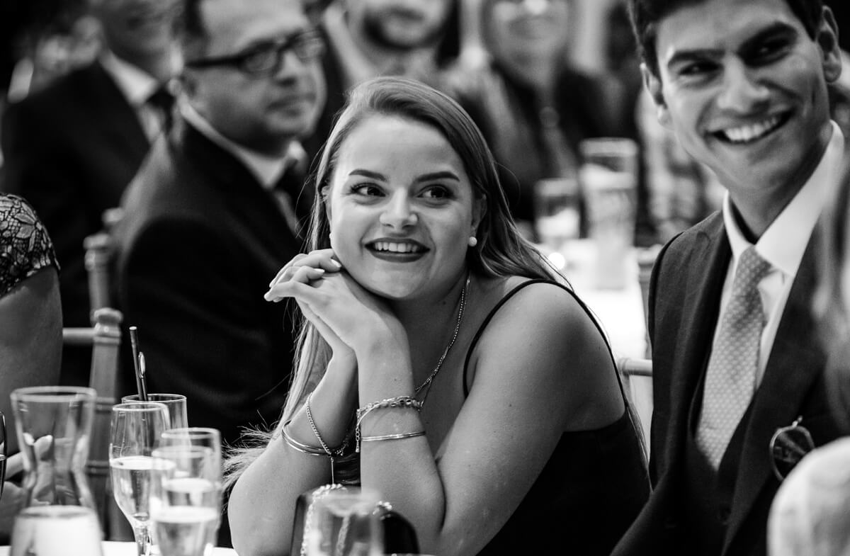 Bridesmaid listening to wedding speech