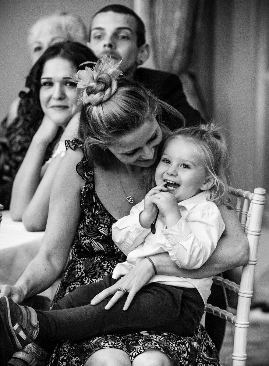Mum and laughing little girl at speeches