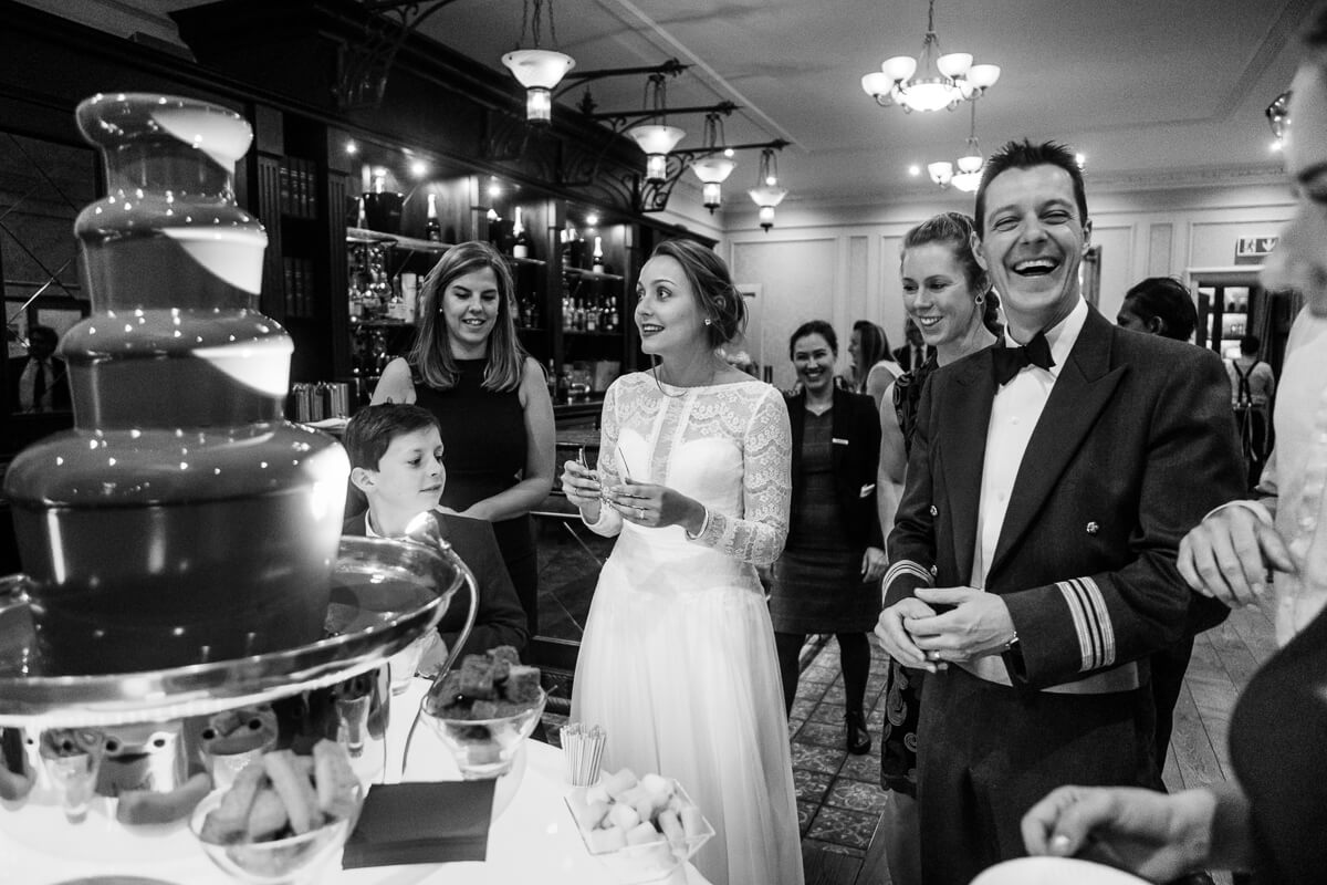 Bride and groom enjoying chocolate fountain at de Vere Latimer wedding