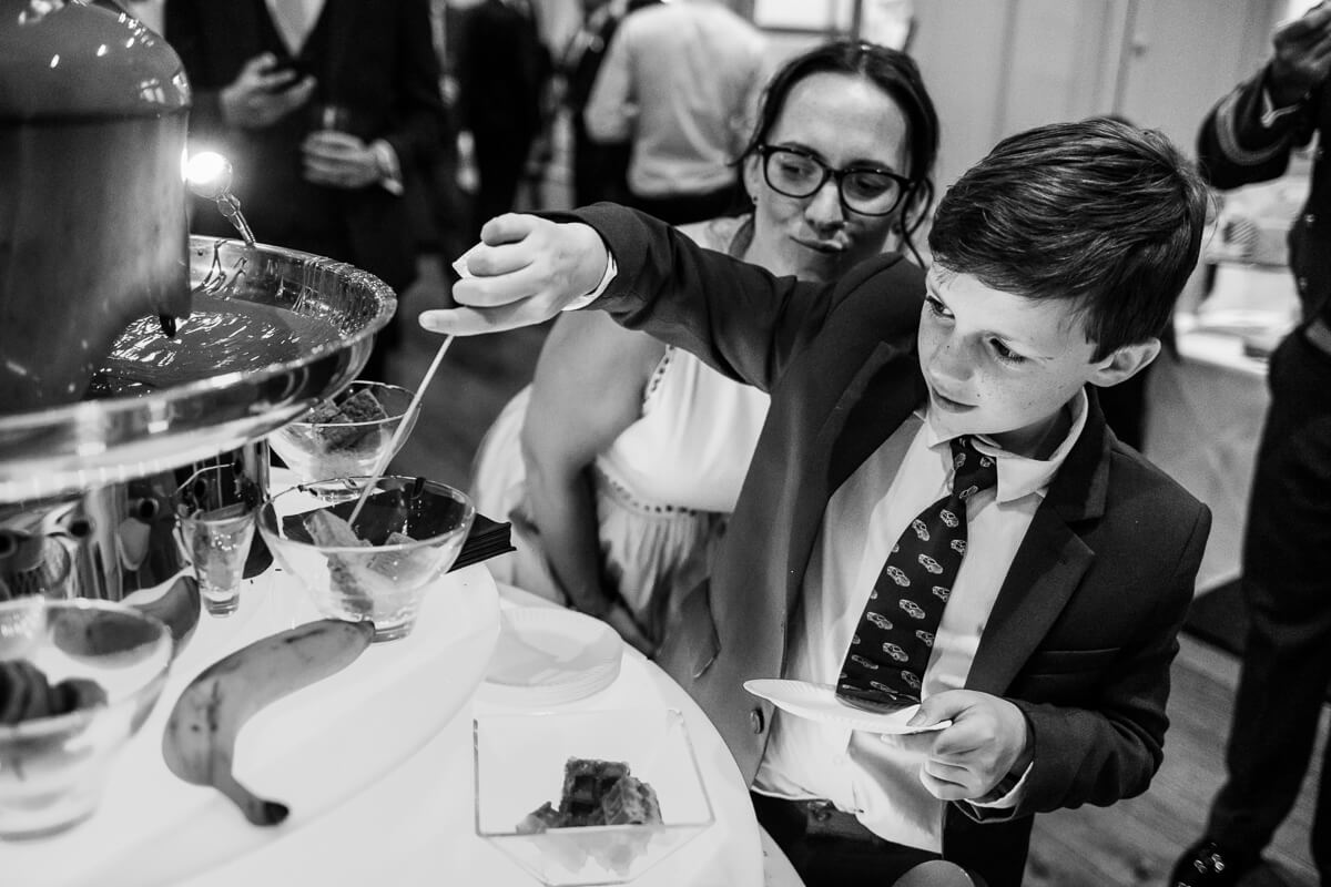 Little boy at chocolate fountain