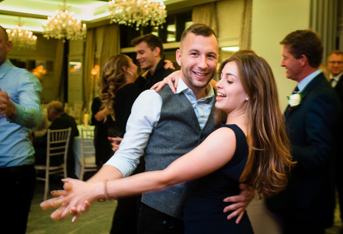 Brides sister dancing with boyfriend