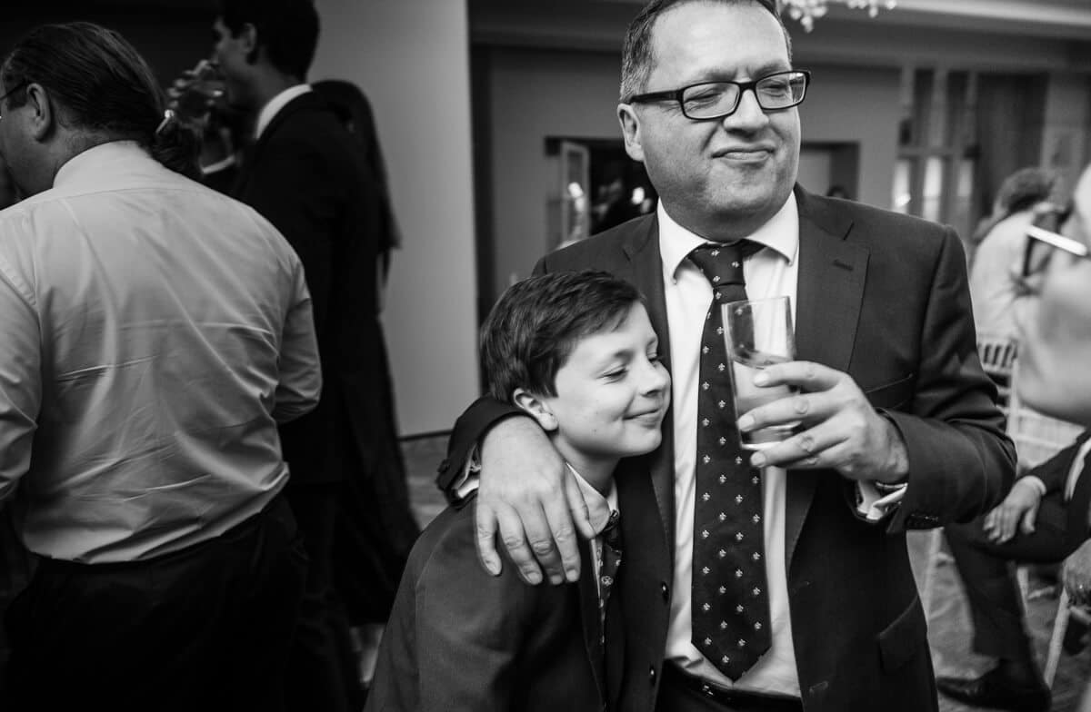 grand so and grand dad hugging at wedding reception