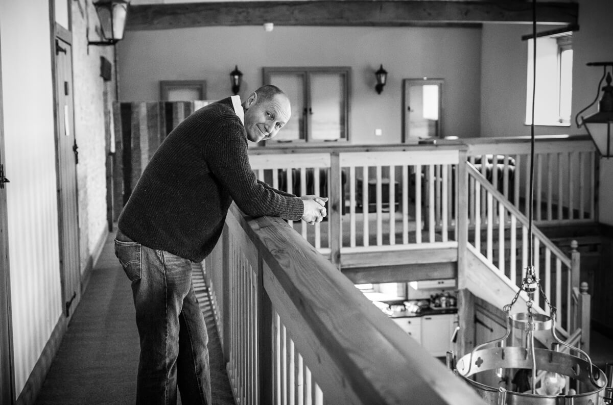 Brides Dad waiting on balcony at wedding preparations