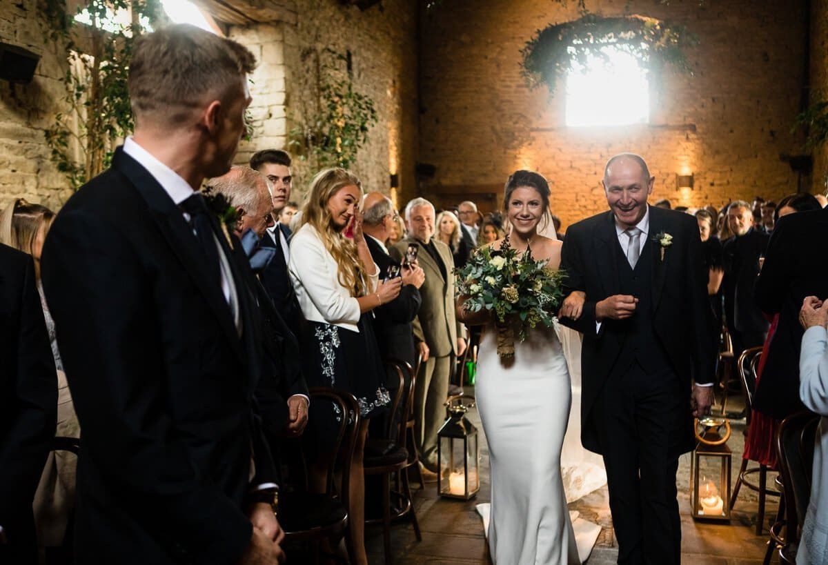 Bride and groom looking at each other for first time at wedding ceremony 