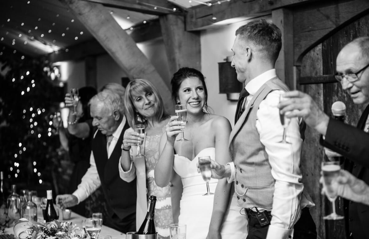 A toast at the head table at Cotswold Wedding