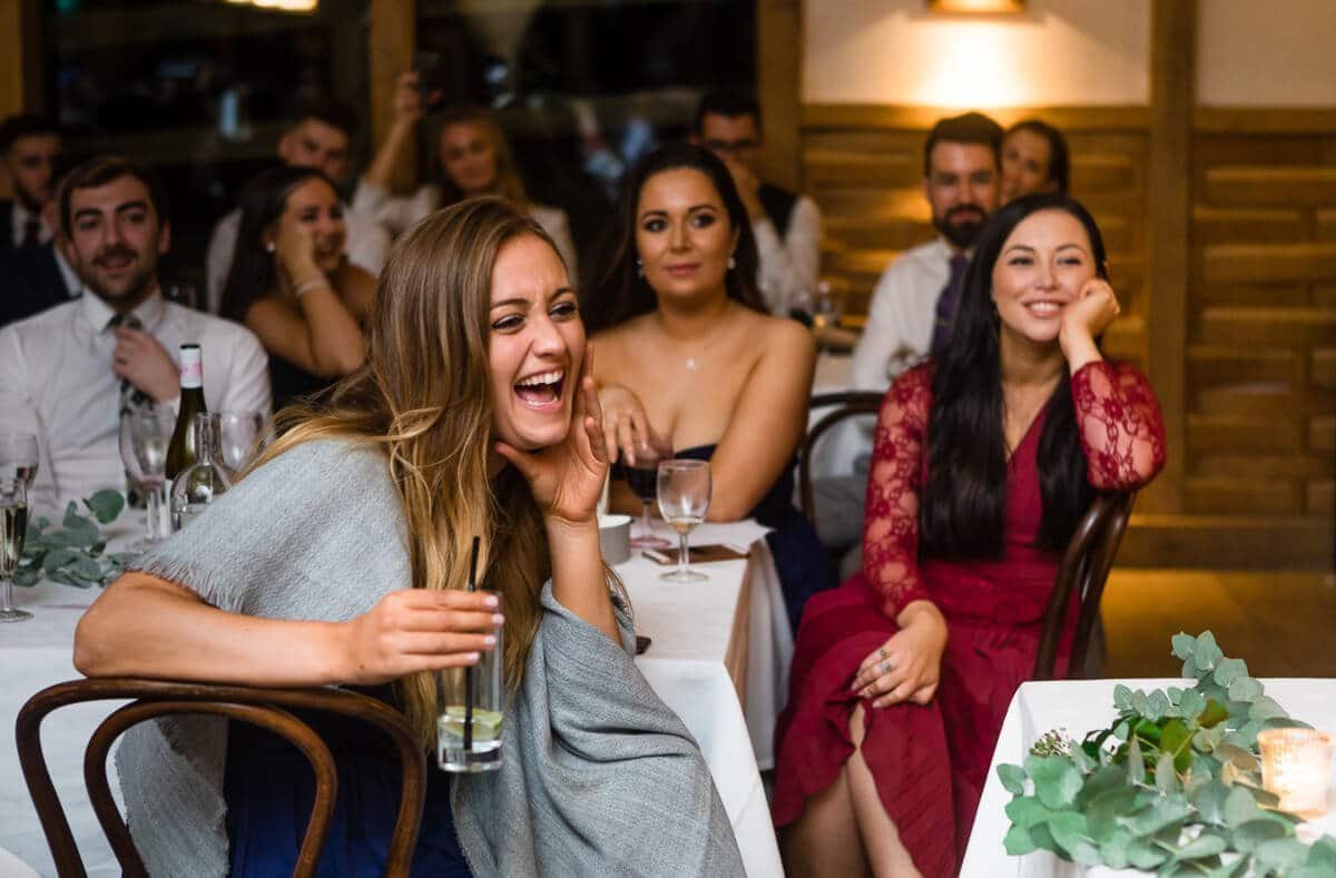 Wedding guests laughing at speeches