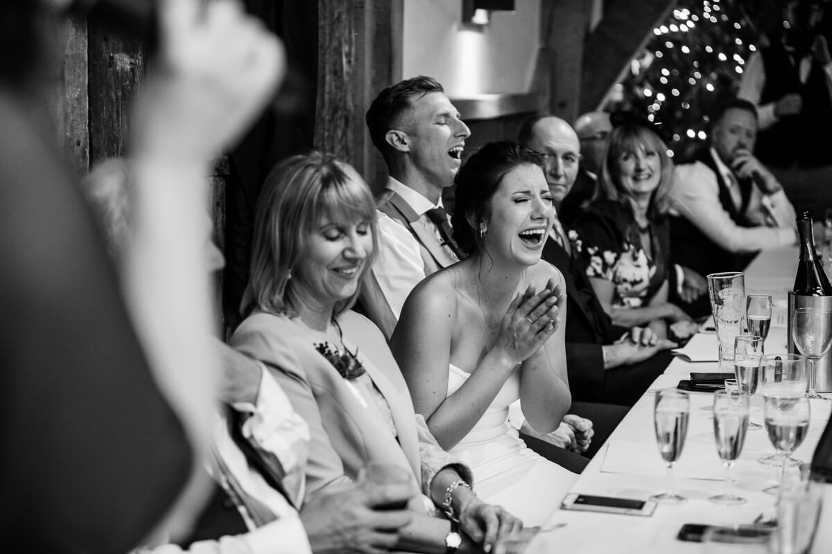 Bride reacting to wedding speeches